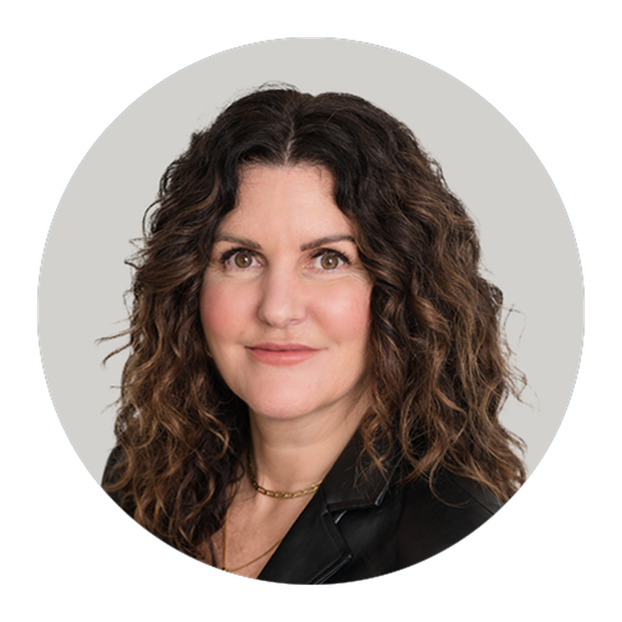 a person with brown hair wearing a black jacket