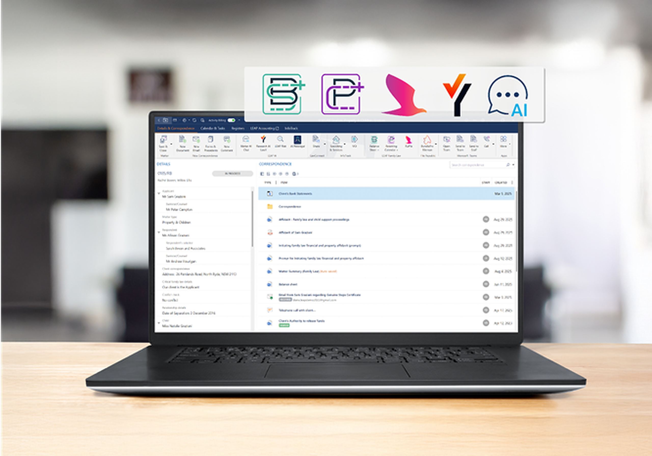Laptop displaying an email inbox on a desk, with icons above the screen representing various software tools or apps.