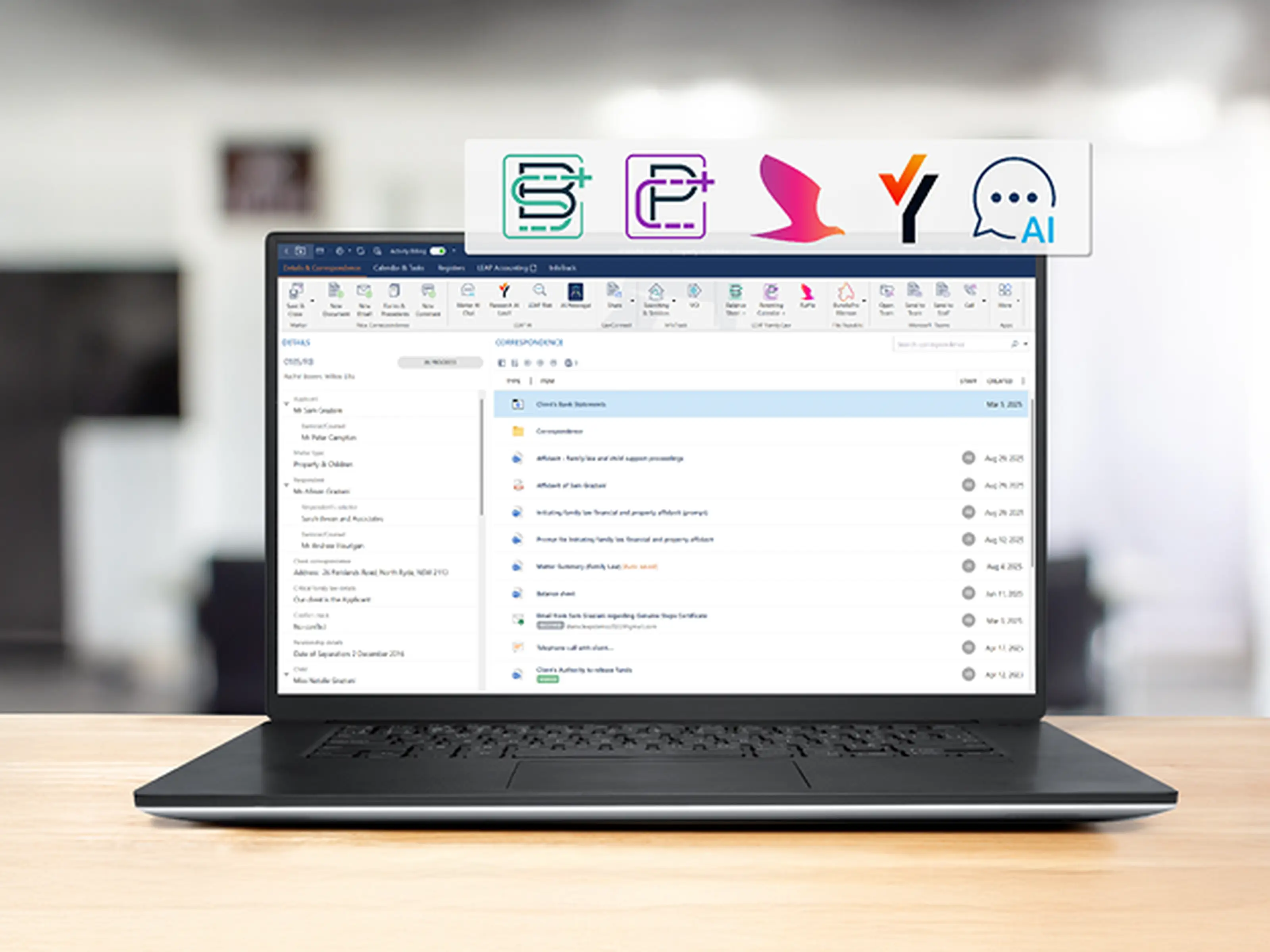 Laptop displaying an email inbox on a desk, with icons above the screen representing various software tools or apps.