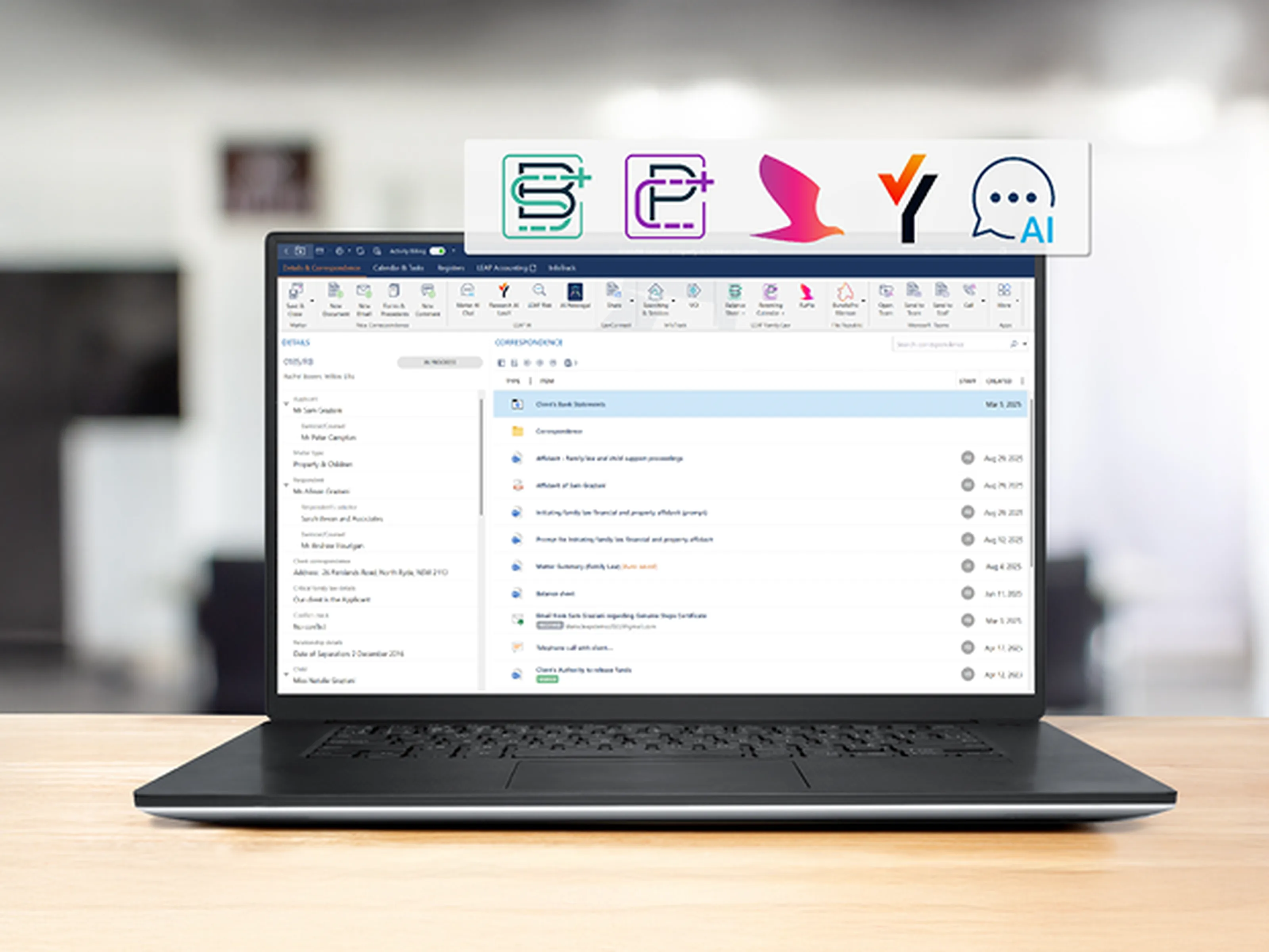 Laptop displaying an email inbox on a desk, with icons above the screen representing various software tools or apps.