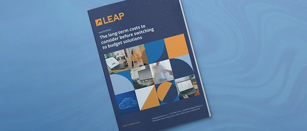 Cover of a report titled "The long-term costs to consider before switching to budget solutions" by LEAP, featuring geometric and office images.