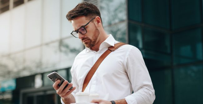 Person holding mobile phone