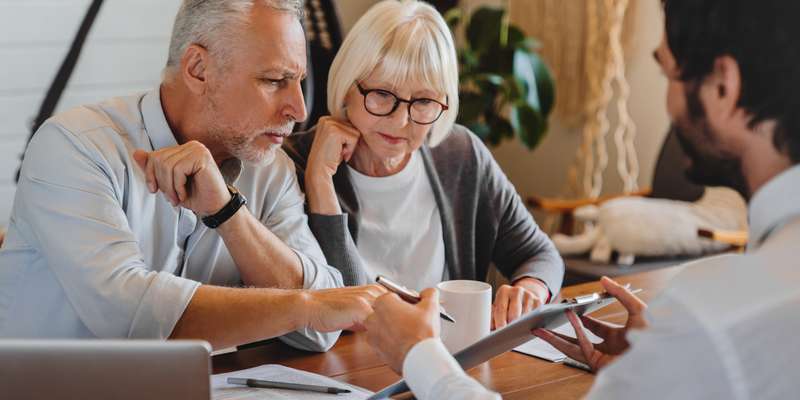 old man and woman reviewing documents