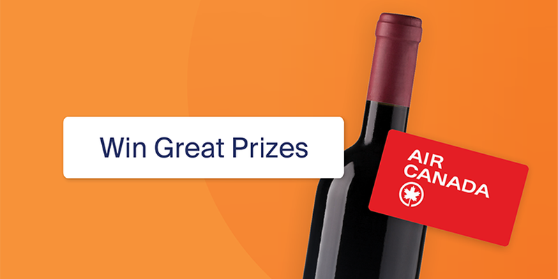 Wine bottle with an Air Canada card against an orange background. Text reads "Win Great Prizes."