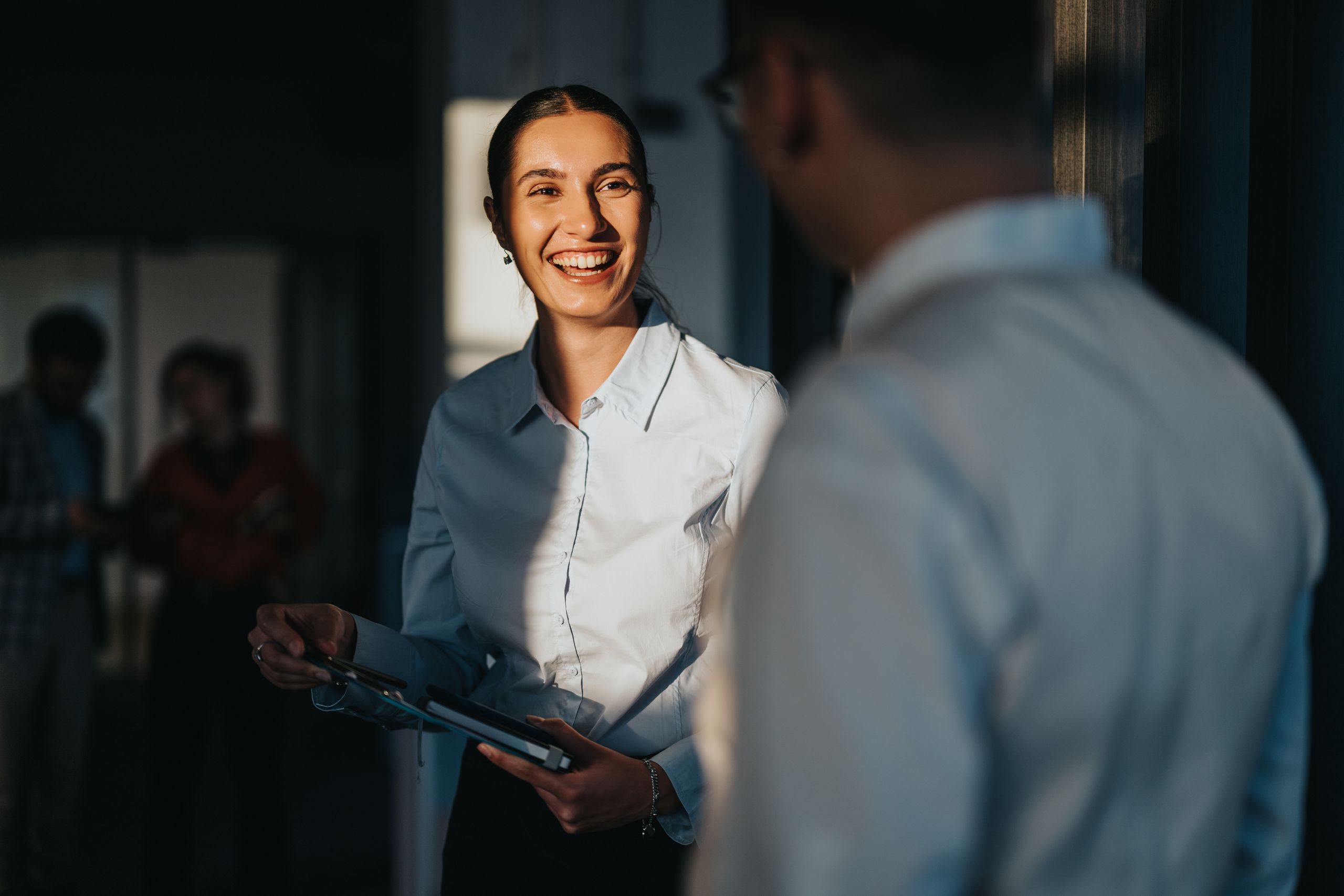 Woman smiling at colleague