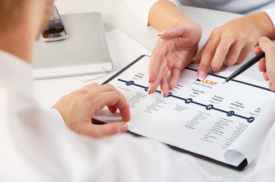 People looking at a clipboard