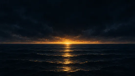 First light on the horizon over a dark sea