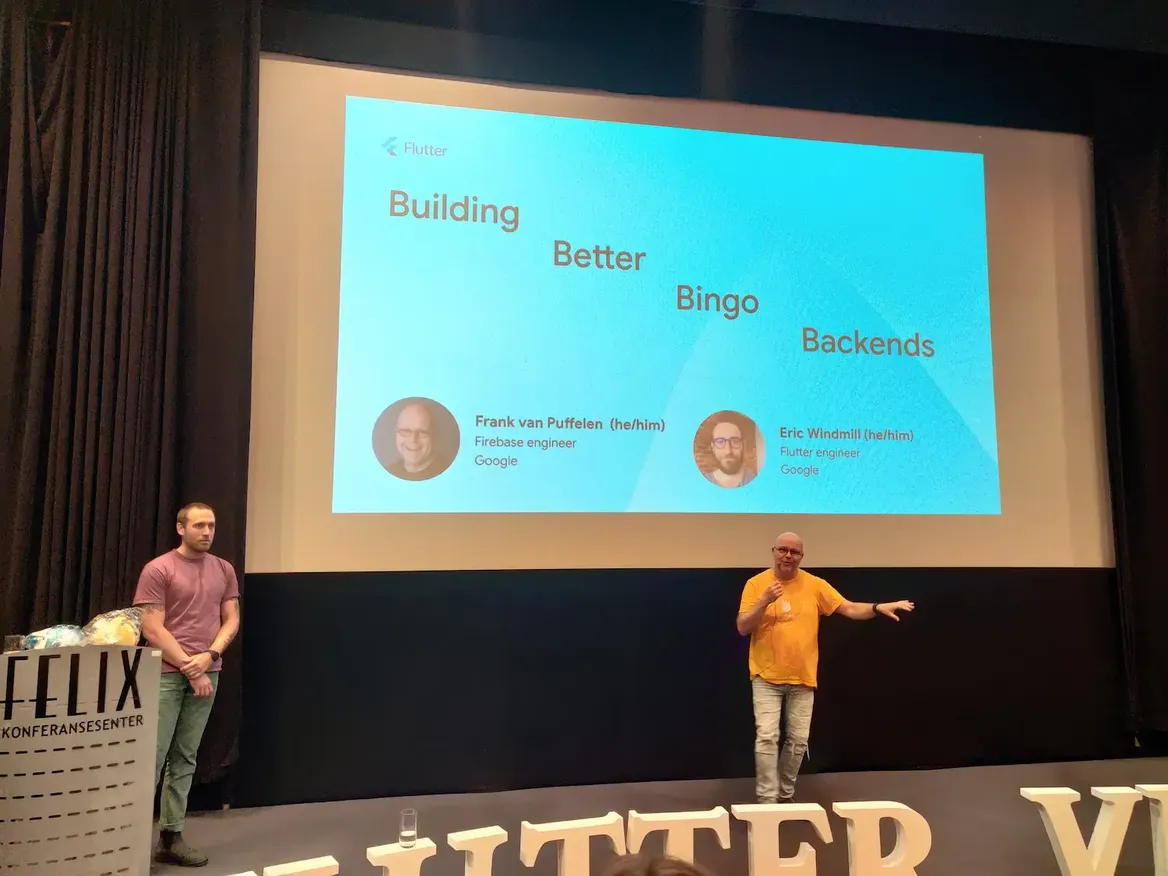 Eric Windmill and Frank van Puffelen on a podium talking about building better bingo backends