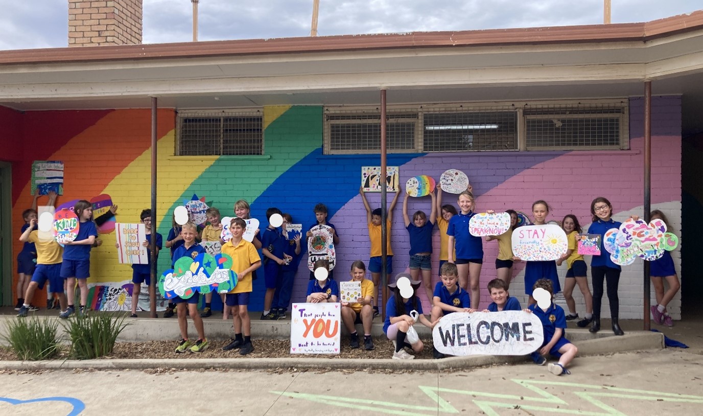 Students at Newlands Primary School hold posters they designed as part of the Community Inquiry Program