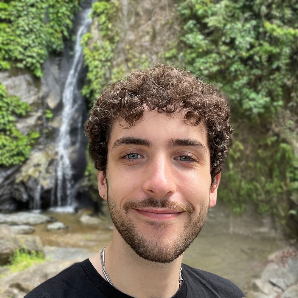 Liam Gavin headshot in front of a waterfall