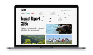Laptop displaying an "Impact Report 2025" with images of nature, wildlife, and a group of people, emphasizing climate and biodiversity.
