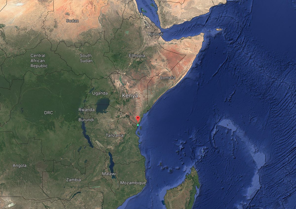 Satellite map of Eastern Africa, showing countries like Kenya, Tanzania, Somalia, and the Indian Ocean to the east. Red pin marks a location.