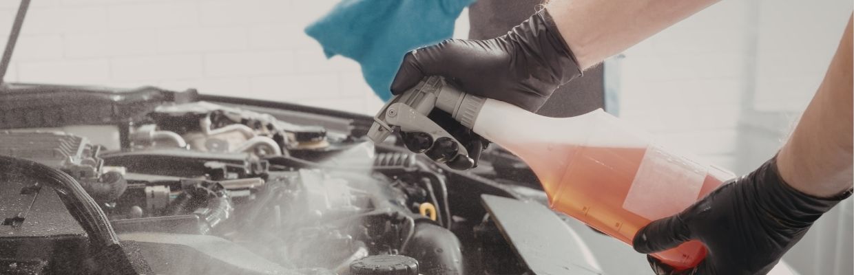 Mechanic Cleaning Car Parts