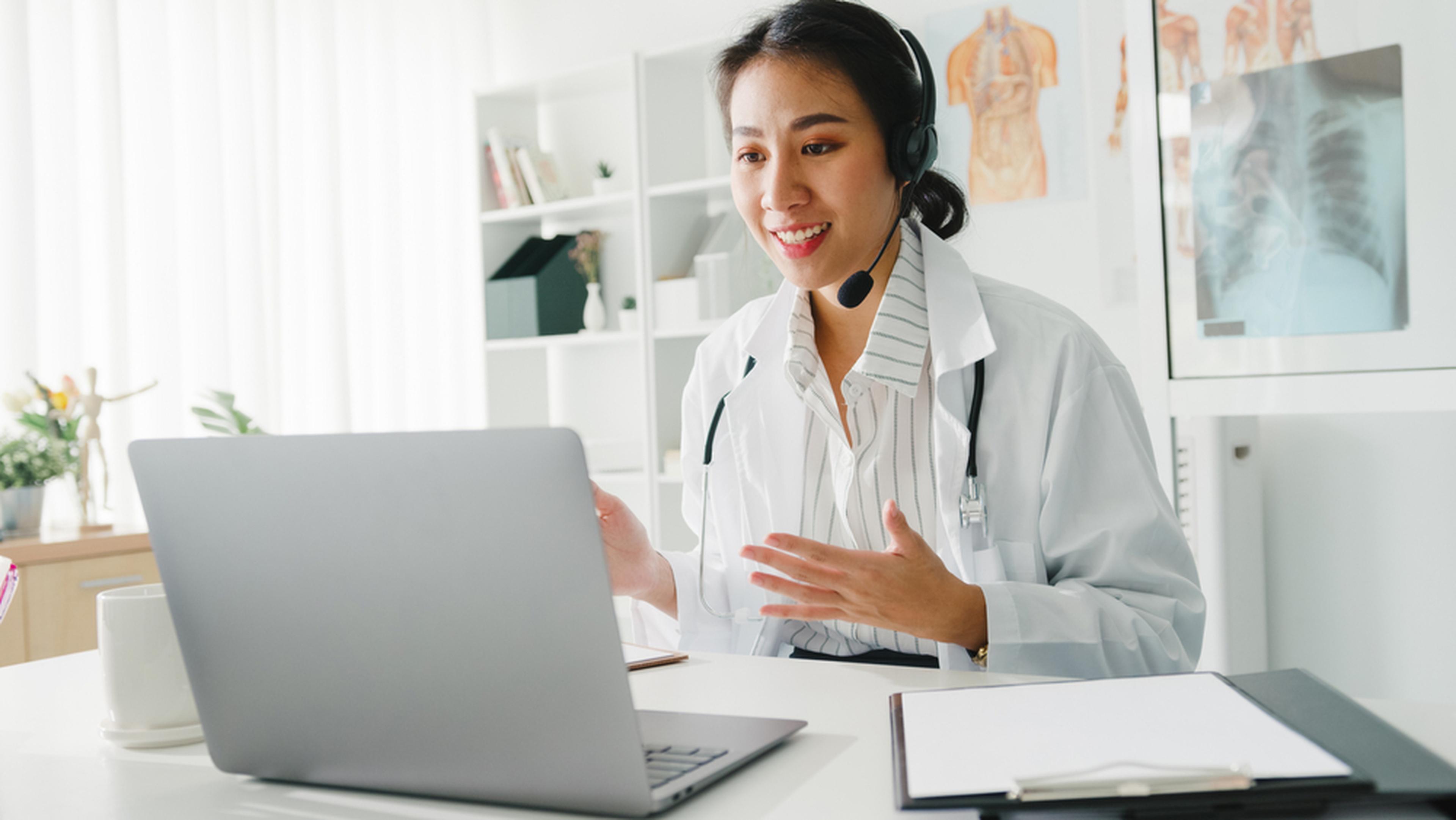 Young female doctor explaining something over telehealth