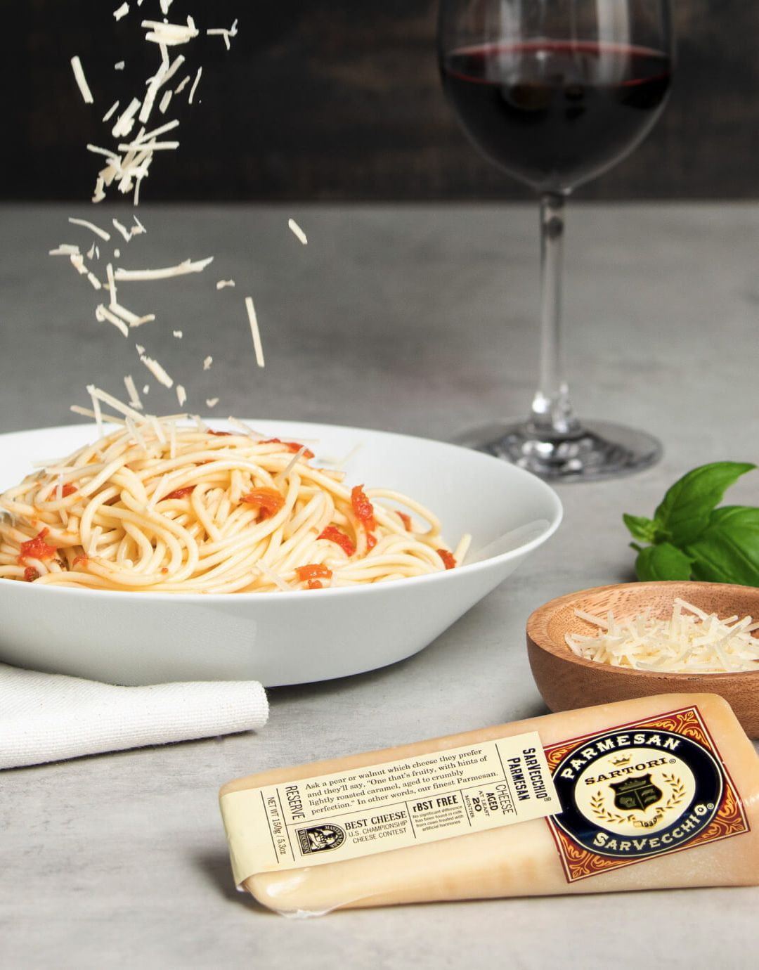 SarVecchio Parmesan sprinkled over pasta.