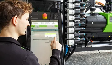Picture shows machine operator using the iQ hold control software