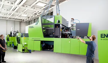 Image shows injection molding machines from ENGEL in stock