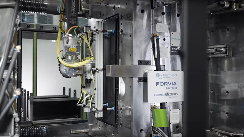 Video shows production of foamed injection moulded parts for automotive interiors