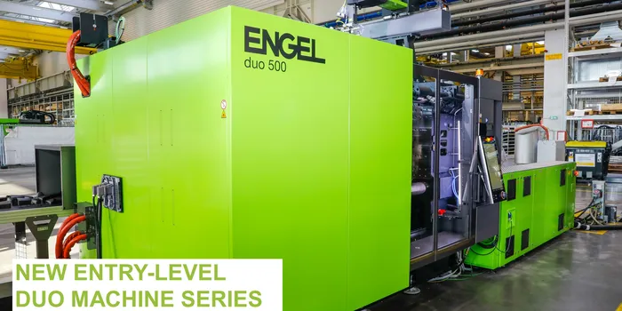 Picture shows large injection moulding machine for automotive components from ENGEL