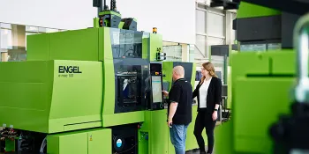 Picture shows injection moulding machine consultation at ENGEL