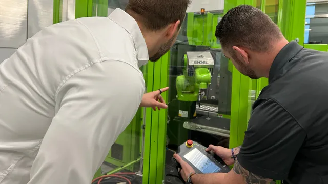 Picture shows conveyor technology of an ENGEL injection molding machine