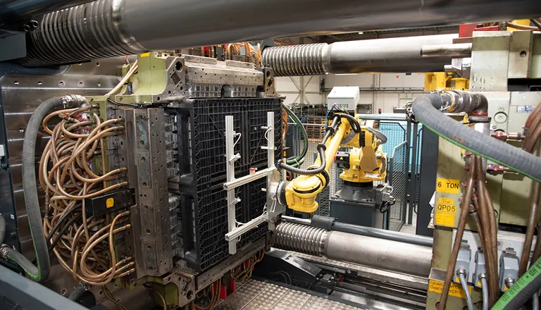 Image shows injection molding cell for two-stage process