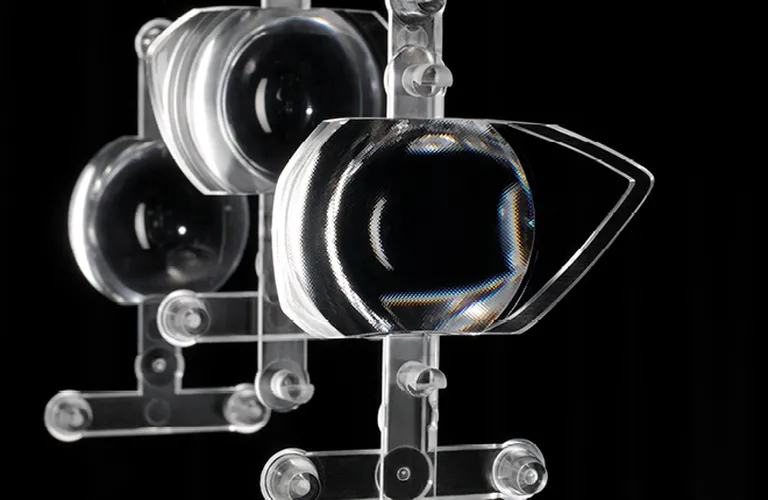 Picture shows injection-moulded transparent lens from ENGEL