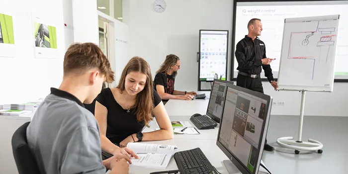 Image shows injection molding training with renowned speakers