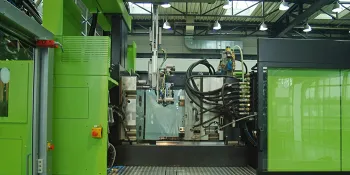 Picture shows linear robot viper removing a component from an injection moulding machine by ENGEL