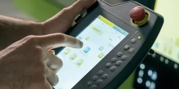 Picture shows robot hand-held control unit from ENGEL