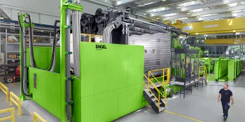 Picture shows large two-platen injection moulding machine from ENGEL