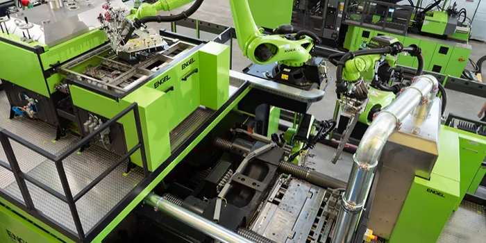 Picture shows automotive injection moulding production line from ENGEL