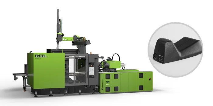 Picture shows large injection moulding machine for automotive components from ENGEL