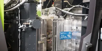 Picture shows tool for the production of precision plastic parts
