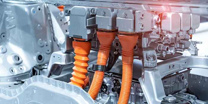 Picture shows high voltage connector in engine compartment of electric car