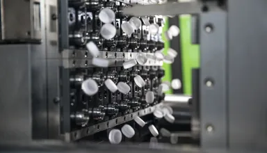 Picture shows production of plastic closures