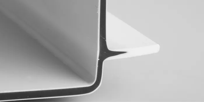 Picture shows component manufactured using the sandwich injection molding process