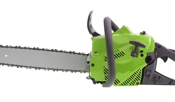 Picture shows green housing of a saw