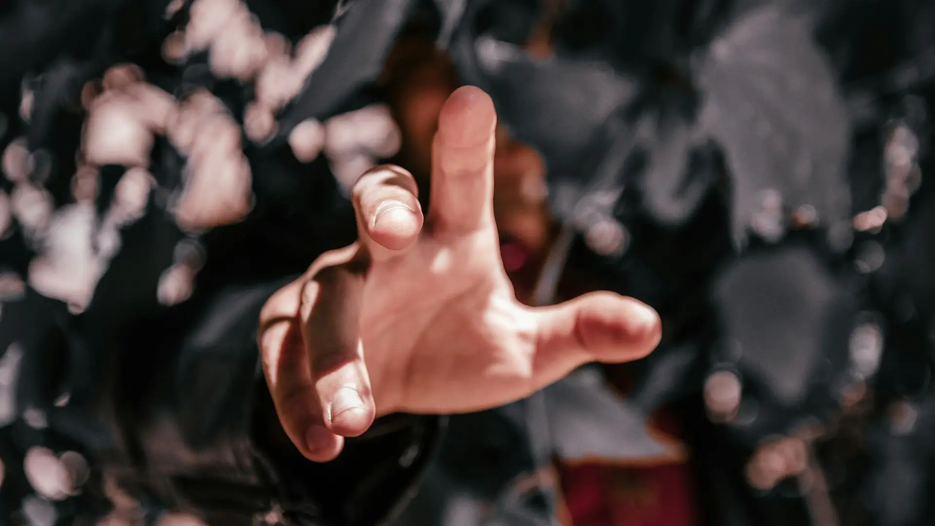 A hand reaching from the ground