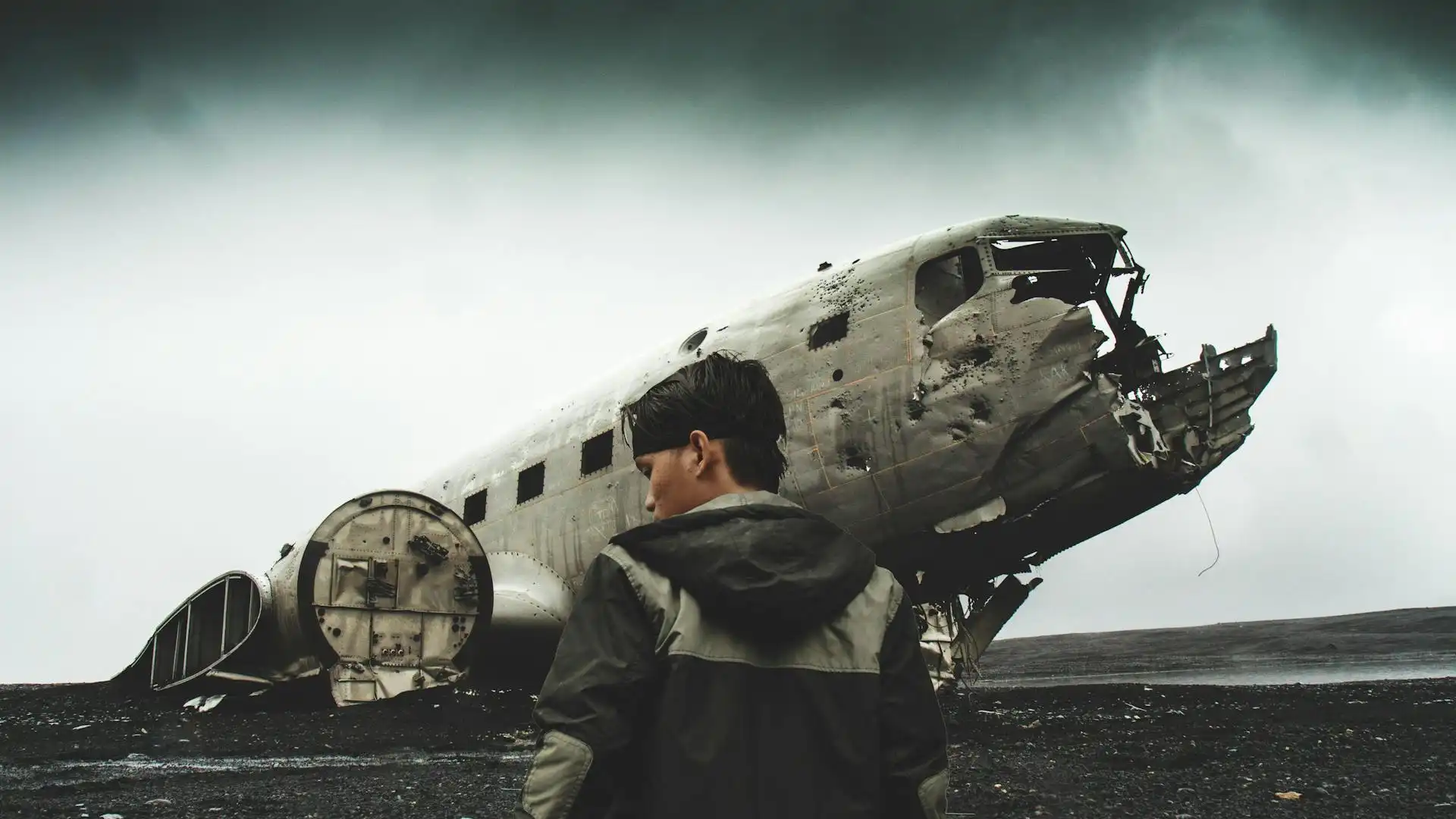 A man near a crashed airplane