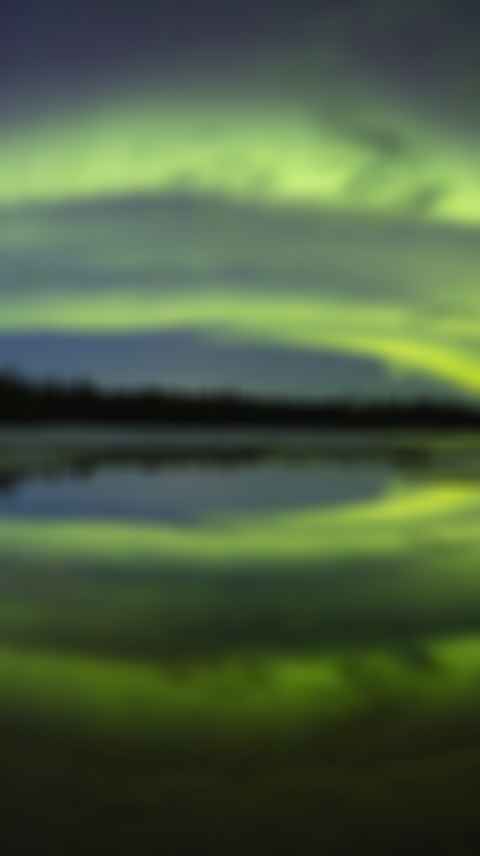 Aurora borealis over lake