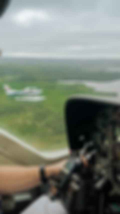 Pilot looking out aircraft window