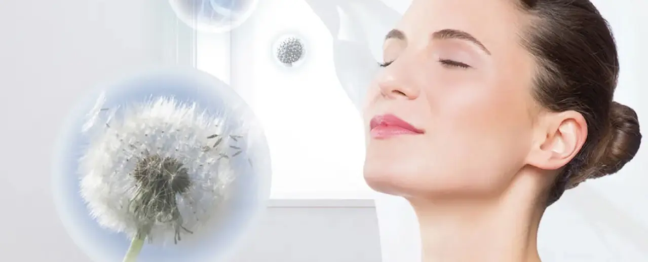 Woman breathes relaxed as pollen and allergens disappear into the air.