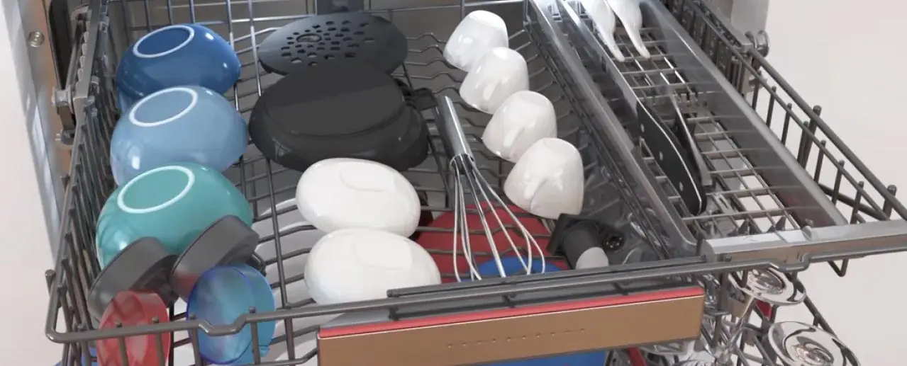 Extended dishwasher rack with cups, bowls and kitchen utensils.