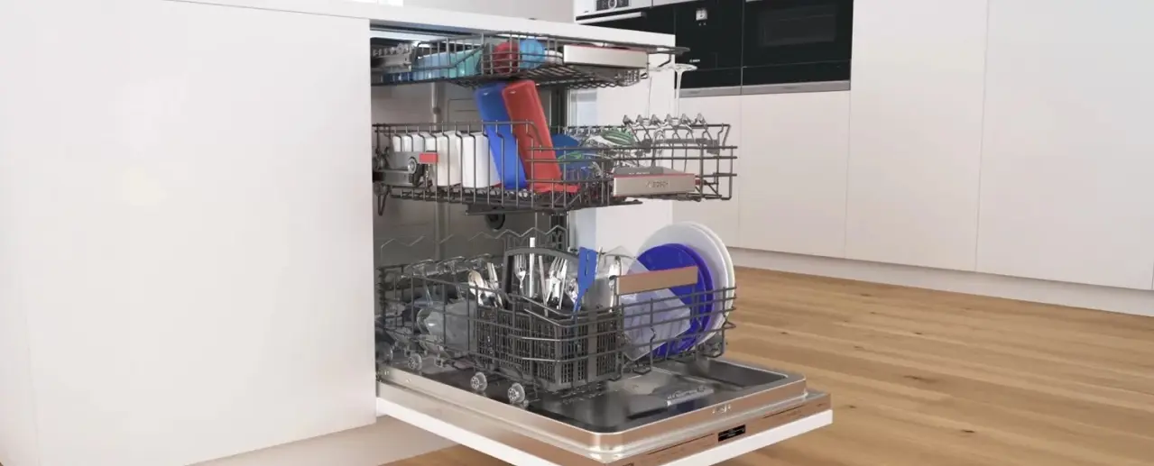 Opened Bosch dishwasher with extended upper and lower baskets.