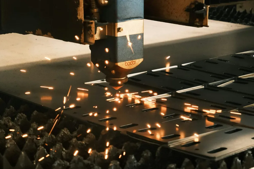 Laser cutting sheet metal with sparks