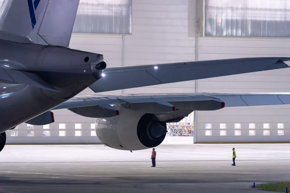 Aircraft wing and engine in a hangar
