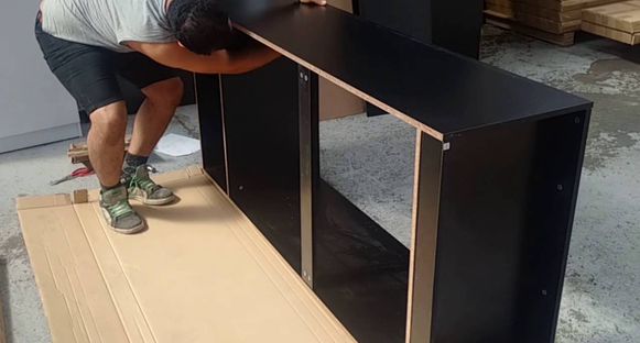 Handyman assembling a wardrobe
