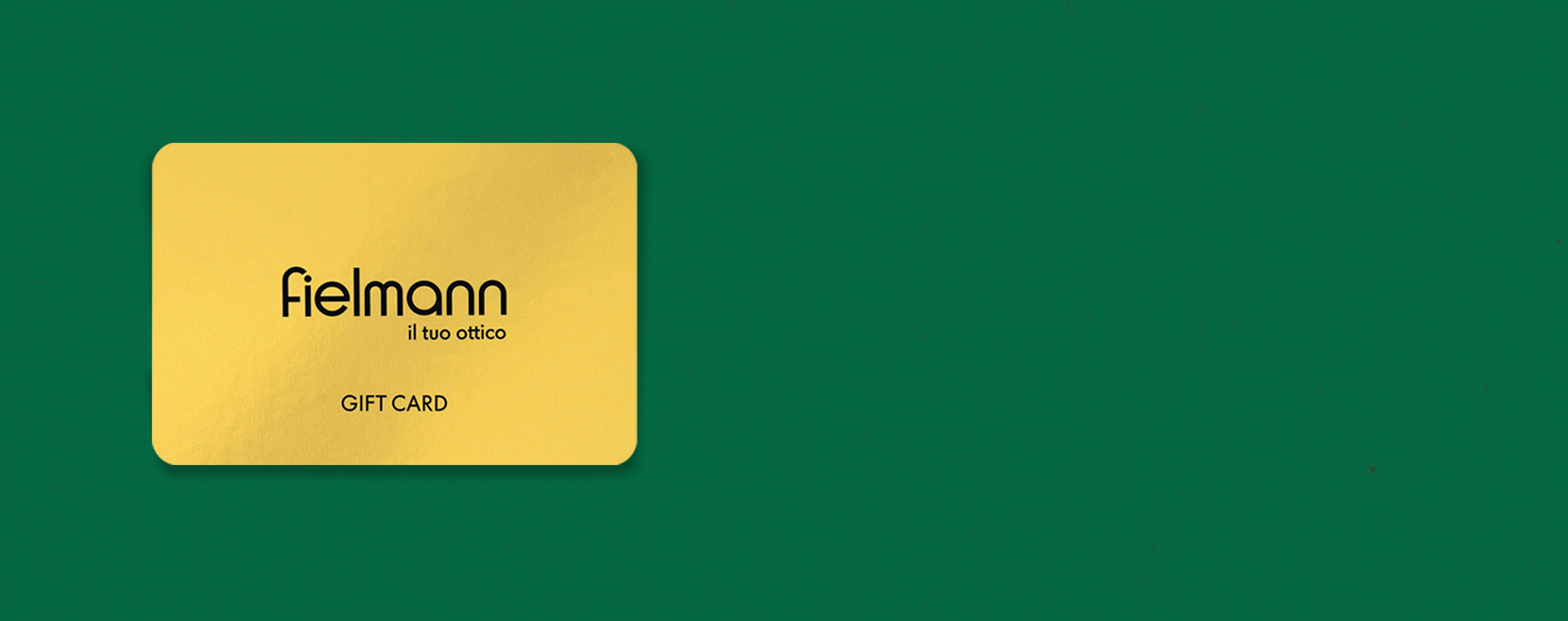 Carta regalo Fielmann color oro su sfondo verde.