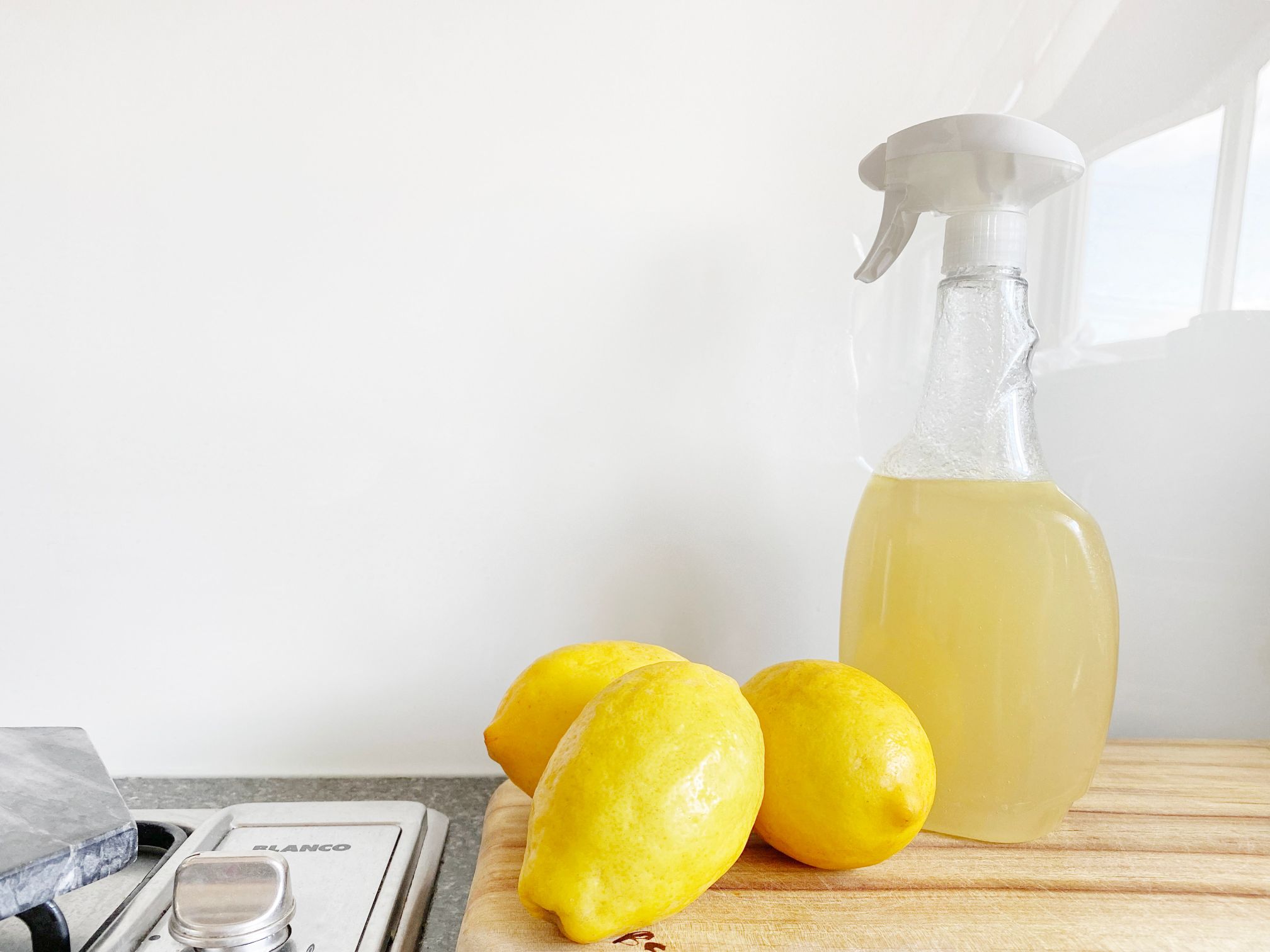 a bottle of cleaning product with lemons